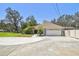 Spacious home featuring an attached two-car garage and extended driveway at 11203 Killearn Ct, Riverview, FL 33569