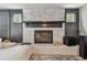 Close up of the living room fireplace with painted brick and mantel at 11203 Killearn Ct, Riverview, FL 33569