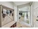 Inviting foyer with tile flooring and a decorative storage bench with coat hooks at 11203 Killearn Ct, Riverview, FL 33569