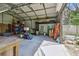Spacious metal garage with workbench, shelving, and ample space for storage and projects at 11203 Killearn Ct, Riverview, FL 33569