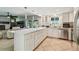 Spacious kitchen with stainless appliances and a seamless view into the Gathering room at 11203 Killearn Ct, Riverview, FL 33569