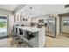 Bright kitchen with stainless appliances, marble countertops, and breakfast bar seating at 11203 Killearn Ct, Riverview, FL 33569