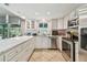 Stylish kitchen with stainless steel appliances and ample cabinet space at 11203 Killearn Ct, Riverview, FL 33569