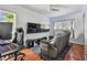 Cozy living room featuring modern gaming setup at 11203 Killearn Ct, Riverview, FL 33569