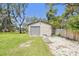 This storage shed in a well-maintained yard offers extra storage space and functionality at 11203 Killearn Ct, Riverview, FL 33569