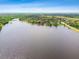 Expansive lake view showing waterfront homes along the shoreline at 11203 Killearn Ct, Riverview, FL 33569