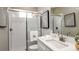 Modern bathroom with glass shower, white subway tile, and a vanity with sleek fixtures at 11236 Kingly Ln, Odessa, FL 33556