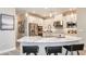 Modern kitchen with white cabinetry, stainless steel appliances, a spacious island, and pendant lighting at 11236 Kingly Ln, Odessa, FL 33556
