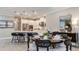 Open concept kitchen and dining area, featuring white cabinets, stainless appliances and a center island at 11236 Kingly Ln, Odessa, FL 33556