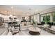 Spacious living area with an open-concept design, modern furniture, and abundant natural light at 11236 Kingly Ln, Odessa, FL 33556