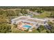 Overhead aerial view of the community clubhouse, pool, and surrounding landscaping at 11446 Sinatra Ct, New Port Richey, FL 34654