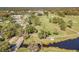 A lush golf course and a scenic lake, creating a picturesque setting for recreation and relaxation at 11446 Sinatra Ct, New Port Richey, FL 34654