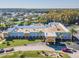 Community clubhouse with a welcoming facade, surrounded by landscaped grounds and mature trees at 11446 Sinatra Ct, New Port Richey, FL 34654