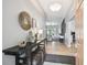 Inviting entryway featuring modern decor, stylish accents, and sleek wood floors at 11446 Sinatra Ct, New Port Richey, FL 34654