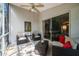 Cozy outdoor patio featuring cushioned wicker furniture and a ceiling fan at 11446 Sinatra Ct, New Port Richey, FL 34654