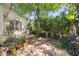 Private outdoor patio featuring lush landscaping, perfect for grilling and relaxing at 11446 Sinatra Ct, New Port Richey, FL 34654