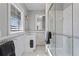 Bathroom featuring a vanity, shower, and a decorative blue and pink tile border at 126 14Th Ne Ave, St Petersburg, FL 33701