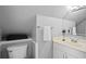 Close-up of a well-lit bathroom with toilet, sink, decorative items and mirror at 126 14Th Ne Ave, St Petersburg, FL 33701