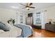 Cozy bedroom with hardwood floors, dresser, and comfortable bed with soft bedding at 126 14Th Ne Ave, St Petersburg, FL 33701