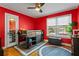 Vibrant red bedroom with hardwood floors, bunk bed, and window view at 126 14Th Ne Ave, St Petersburg, FL 33701
