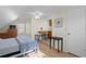 Cozy bedroom featuring a dining area, ceiling fan and light hardwood flooring at 126 14Th Ne Ave, St Petersburg, FL 33701