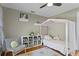 Comfortable bedroom with hardwood floors, a canopy bed, and a bookshelf with toys at 126 14Th Ne Ave, St Petersburg, FL 33701