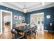 Stylish dining room with blue walls, coffered ceiling, and modern furniture, ideal for entertaining at 126 14Th Ne Ave, St Petersburg, FL 33701