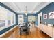 Elegant dining room features a dark wood table, chandelier, and access to multiple rooms at 126 14Th Ne Ave, St Petersburg, FL 33701