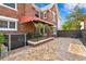 Brick house with covered patio and patterned flooring, featuring lush landscaping at 126 14Th Ne Ave, St Petersburg, FL 33701