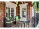 Patio with wicker seating, pillows, and a small table and garden views at 126 14Th Ne Ave, St Petersburg, FL 33701