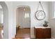 Inviting foyer featuring archways, cabinet with a mirror, and patterned floors at 126 14Th Ne Ave, St Petersburg, FL 33701