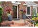 Inviting front entrance with decorative planters and patterned tile steps at 126 14Th Ne Ave, St Petersburg, FL 33701