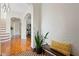 Bright hallway with arched doorways, hardwood floors and decorative bench at 126 14Th Ne Ave, St Petersburg, FL 33701