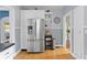 Spacious kitchen featuring stainless steel appliances, white cabinetry, and hardwood floors at 126 14Th Ne Ave, St Petersburg, FL 33701
