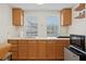 Compact kitchenette features wood cabinets, stainless appliances, and lots of counter space at 126 14Th Ne Ave, St Petersburg, FL 33701