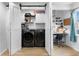 Modern laundry area with washer, dryer, and a desk with a built-in workspace at 126 14Th Ne Ave, St Petersburg, FL 33701