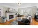 Elegant living room featuring a fireplace, chandelier, bay window, and stylish decor at 126 14Th Ne Ave, St Petersburg, FL 33701