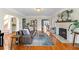 Open-concept living room with hardwood floors, a fireplace, and a view into other rooms at 126 14Th Ne Ave, St Petersburg, FL 33701