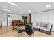 Open-concept living room with workout area, kitchen, leather sofa, and lots of space at 126 14Th Ne Ave, St Petersburg, FL 33701