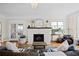 Cozy living room with a fireplace, a decorative chandelier, and plush seating, perfect for relaxation at 126 14Th Ne Ave, St Petersburg, FL 33701