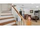 View of the staircase as it goes to the main living area with small kitchen and living room at 126 14Th Ne Ave, St Petersburg, FL 33701