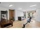 Bright workout room with wood floors, seating area, and sliding doors to outside pool area at 126 14Th Ne Ave, St Petersburg, FL 33701