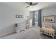 Charming bedroom featuring neutral colored wall, comfortable bed and dresser at 13734 Whiskey Daisy Dr, Dade City, FL 33525