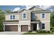 Two-story home boasts attached two car garage, neutral siding, and manicured front lawn at 1645 Longliner Loop, Wesley Chapel, FL 33543