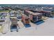 Stunning aerial view of beachfront property with white sand and nearby condominiums at 17606 Lee Ave, Redington Shores, FL 33708