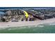 Aerial view of beachfront houses and buildings with a nearby beach and ocean views at 17606 Lee Ave, Redington Shores, FL 33708