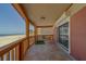 Balcony with seating, ocean views, and tiled flooring detail at 17606 Lee Ave, Redington Shores, FL 33708