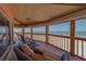 Comfortable wicker sofa on a balcony offering breathtaking ocean views at 17606 Lee Ave, Redington Shores, FL 33708