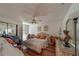 Cozy bedroom with a comfortable bed, ceiling fan, and ample natural light from the windows at 17606 Lee Ave, Redington Shores, FL 33708