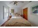 Bright bedroom featuring hardwood floors, natural light, and a comfortable bed at 17606 Lee Ave, Redington Shores, FL 33708